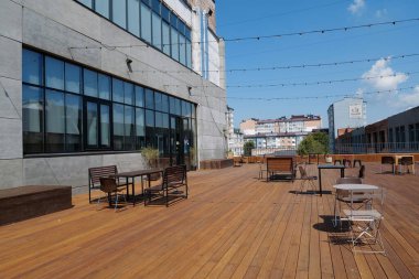 IVANO-FRANKIVSK, UKRAINE, AUGUST 20, 2022: People in coworking space PROMPRYLAD in former factory workshop. Coworking - arrangement in which workers of many companies share an office space