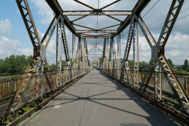 Old metal bridge across the Dniester river in the city of Galich or Halych, western Ukraine