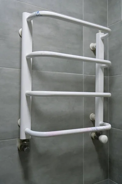 Heated towel rail in bathroom