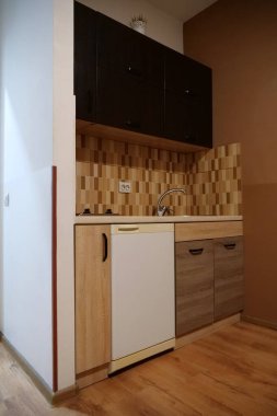 Built-in empty mini fridge in the kitchen