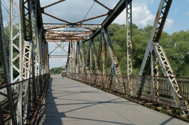 Old metal bridge across the Dniester river in the city of Galich or Halych, western Ukraine