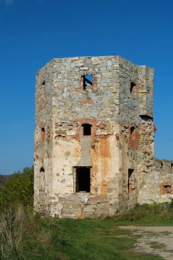 Ancient stone tower, turret in Pniv Castle - medieval historical object in Ivano-Frankivsk region of western Ukraine