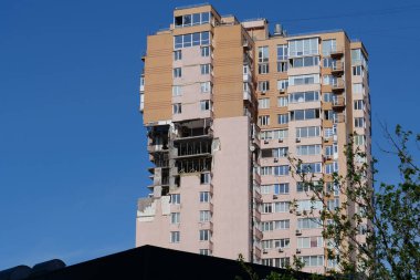 KYIV, UKRAINE, MAY 11, 2022: After bombing. War in Ukraine. Terror and genocide of Ukrainian people. Russian terrorists damaged by missile dwelling house in Kyiv on end of February 2022