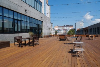 IVANO-FRANKIVSK, UKRAINE, AUGUST 20, 2022: People in coworking space PROMPRYLAD in former factory workshop. Coworking - arrangement in which workers of many companies share an office space