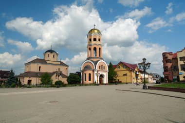 HALYCH, UKRAINE, AUGUST 20, 2022: People near Church of the Nativity of Christ, 14-15 century in Halych town, western Ukraine