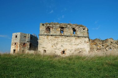 Ancient stone tower, turret in Pniv Castle - medieval historical object in Ivano-Frankivsk region of western Ukraine