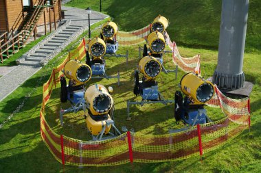 BUKOVEL, UKRAINE, OCTOBER 13, 2022: Snow-making cannons in Bukovel - popular ski resort in Carpathian Mountains, western Ukraine