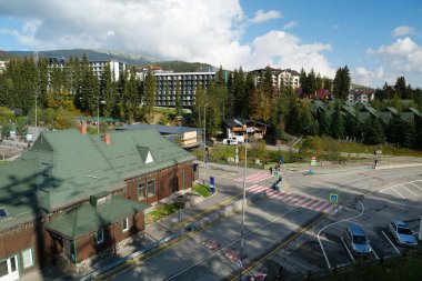 BUKOVEL, UKRAINE, OCTOBER 13, 2022: People in Bukovel - beautiful village and largest ski resort in Carpathian Mountains, Ivano-Frankivsk Oblast, western Ukraine