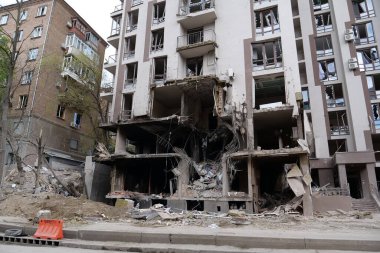 KYIV, UKRAINE, APRIL 29, 2022: After bombing. Dwelling house destroyed by russian missile in Kyiv city on end of April 2022. Russian aggression. War in Ukraine. Terror and genocide of Ukrainian people