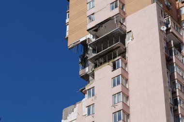 KYIV, UKRAINE, MAY 11, 2022: Russian missile damaged multi-storey dwelling building in Kiev city on February 26, 2022. Russian aggression. War in Ukraine. Terror and genocide of Ukrainian people