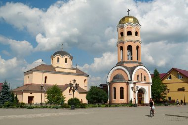 HALYCH, UKRAINE, AUGUST 20, 2022: People near Church of the Nativity of Christ, 14-15 century in Halych town, western Ukraine