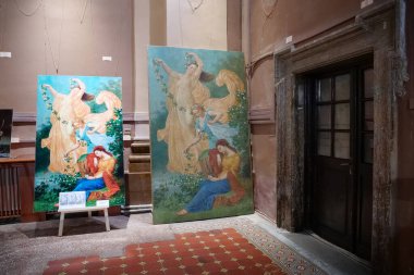 IVANO-FRANKIVSK, UKRAINE, AUGUST 22, 2022: Exhibition of paintings in Church of the Blessed Virgin Mary, an now art museum on Sheptitskogo Square in Ivano-Frankivsk city, western Ukraine
