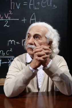 UKRAINE, BUKOVEL, OCTOBER 13, 2022: World-famous scientist, Nobel laureate, theoretical physicist, creator of theory of relativity Albert Einstein, who sits at the table
