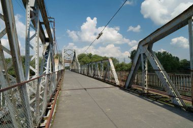 Old metal bridge across the Dniester river in the city of Galich or Halych, western Ukraine