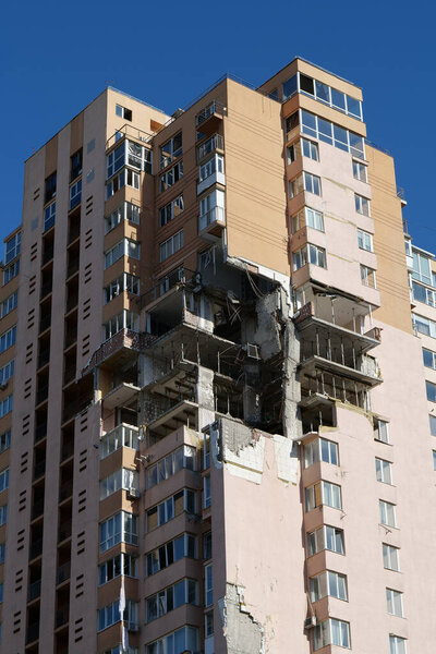 KYIV, UKRAINE, MAY 11, 2022: Russian missile damaged multi-storey dwelling building in Kiev city on February 26, 2022. Russian aggression. War in Ukraine. Terror and genocide of Ukrainian people