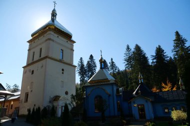 Manyava Skete of Exaltation of Holy Cross in the forest in Carpathian mountains, Ukraine. Orthodox solitary cell mens monastery, skete. Near skete in wood there is Blessed Stone, object of worship