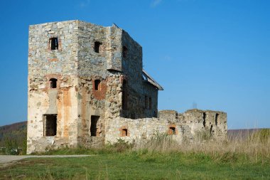 Ancient stone tower, turret in Pniv Castle - medieval historical object in Ivano-Frankivsk region of western Ukraine