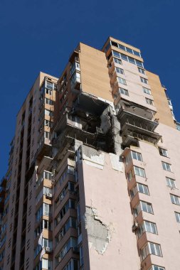 KYIV, UKRAINE, MAY 11, 2022: Russian missile damaged multi-storey dwelling building in Kiev city on February 26, 2022. Russian aggression. War in Ukraine. Terror and genocide of Ukrainian people