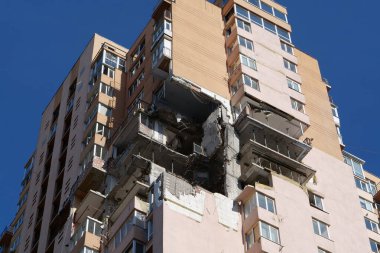 KYIV, UKRAINE, MAY 11, 2022: Russian missile damaged multi-storey dwelling building in Kiev city on February 26, 2022. Russian aggression. War in Ukraine. Terror and genocide of Ukrainian people