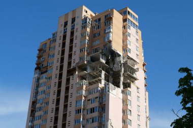 KYIV, UKRAINE, MAY 11, 2022: After bombing. War in Ukraine. Terror and genocide of Ukrainian people. Russian terrorists damaged by missile dwelling house in Kyiv on end of February 2022