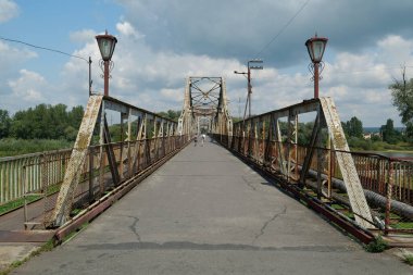 Old metal bridge across the Dniester river in the city of Galich or Halych, western Ukraine
