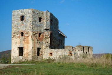 Ancient stone tower, turret in Pniv Castle - medieval historical object in Ivano-Frankivsk region of western Ukraine