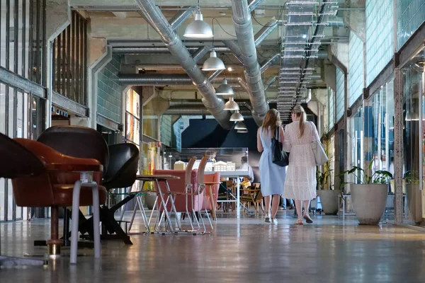 stock image IVANO-FRANKIVSK, UKRAINE, AUGUST 20, 2022: People in coworking space PROMPRYLAD in former factory workshop. Coworking - arrangement in which workers of many companies share an office space