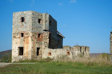 Ancient stone tower, turret in Pniv Castle - medieval historical object in Ivano-Frankivsk region of western Ukraine