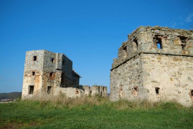 Ancient stone towers in Pniv Castle - medieval historical object in Ivano-Frankivsk region of western Ukraine