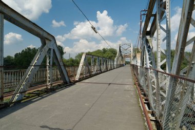 Old metal bridge across the Dniester river in the city of Galich or Halych, western Ukraine