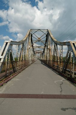 Old metal bridge across the Dniester river in the city of Galich or Halych, western Ukraine