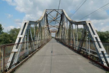 Old metal bridge across the Dniester river in the city of Galich or Halych, western Ukraine