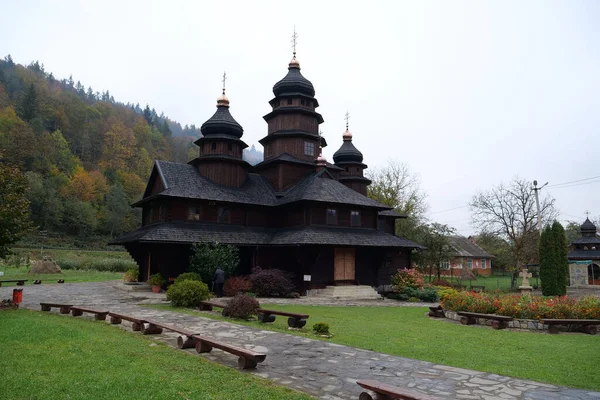 stock image Church of Holy Prophet Ilya is a unique architectural monument built in Hutsul style in shape of cross in Yaremche city, western Ukraine, Carpathian Mountains