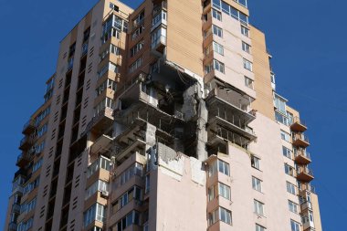KYIV, UKRAINE, MAY 11, 2022: Russian missile damaged multi-storey dwelling building in Kiev city on February 26, 2022. Russian aggression. War in Ukraine. Terror and genocide of Ukrainian people