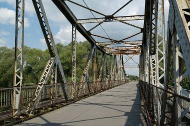 Old metal bridge across the Dniester river in the city of Galich or Halych, western Ukraine
