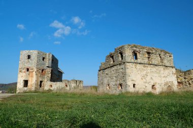 Ancient stone towers in Pniv Castle - medieval historical object in Ivano-Frankivsk region of western Ukraine