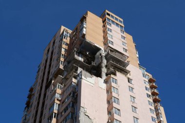KYIV, UKRAINE, MAY 11, 2022: Russian missile damaged multi-storey dwelling building in Kiev city on February 26, 2022. Russian aggression. War in Ukraine. Terror and genocide of Ukrainian people