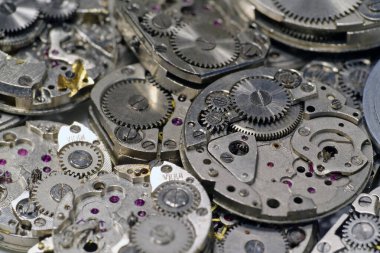 Clockwork details and parts, macro shots. Old mechanical watches with gears and cogs. Watch or clock mechanisms, close-up shot. Time or repair concept  clipart