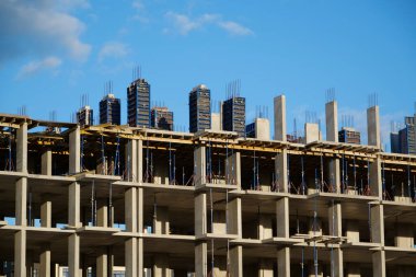 Unfinished construction of dwelling house. New reinforced concrete building under construction, cast concrete structure clipart