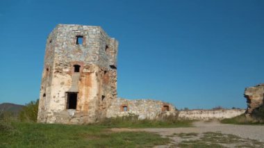 Stone tower in Pniv Castle - medieval historical object in Ivano-Frankivsk region of western Ukraine