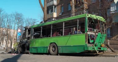 UKRAINE, KYIV, MARCH 20, 2022: Russian missile destroyed trolleybus and houses in Kyiv on March 14, 2022. After bombing. Russian aggression. War in Ukraine. Terror and genocide of Ukrainian people