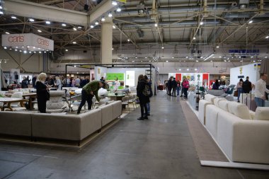 KYIV, UKRAINE, OCTOBER 25, 2023: People at international exhibitions Inter Build Expo and Design Living Tendency, furniture forum KIFF in international exhibition center in Kyiv clipart