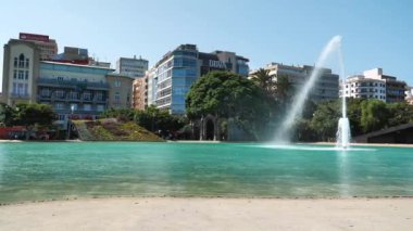 CANARY ISLANDS, SANTA CRUZ DE TENERIFE, SPAIN, SEPTEMBER 27, 2019: Fountain and pool on the Spain Square in Santa Cruz de Tenerife, Canary islands, Spain