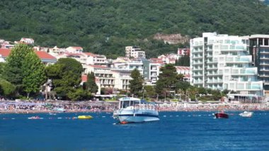 MONTENEGRO, PETROVAC, JULY 1, 2019: People on the beach in Petrovac city, Montenegro, Adriatic Sea