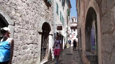 MONTENEGRO, KOTOR, JULY 1, 2019: People inside old historical town of Kotor - coastal town in Montenegro, Bay of Kotor, Adriatic Sea