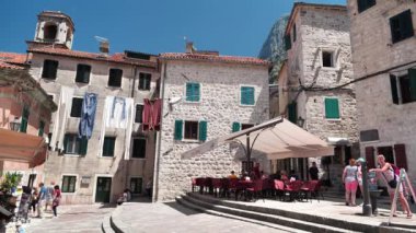 MONTENEGRO, KOTOR, JULY 1, 2019: People inside old historical town of Kotor - coastal town in Montenegro, Bay of Kotor, Adriatic Sea