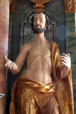 Saint Dismas, statue on the main altar of the parish church of Holy Trinity in Klenovnik, Croatia clipart