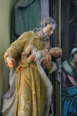 Çocuk İsa 'yı tutan Aziz Joseph, Hırvatistan' ın Pisarovinska Jamnica kentindeki Aziz Martin Kilisesi 'ndeki Kutsal Üç Kral' ın mihrabında heykeli.