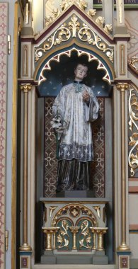 St. Aloysius statue on altar of Our Lady of Lourdes in the church of Saint Matthew in Stitar, Croatia clipart