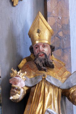 Hippo 'lu Aziz Augustine, Hırvatistan' ın Cazma kentindeki Aziz Meryem Kilisesi 'nde Meryem Ana' nın taç giyme töreninin sunağında heykel.